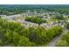 An aerial view of a neighborhood with houses and trees near a road at 614 Oldham Ln, Rock Hill, SC 29732