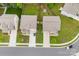 Aerial view of homes showing landscaping and driveway, new roofs, and proximity to a quiet neighborhood street at 614 Oldham Ln, Rock Hill, SC 29732
