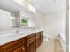 Bathroom featuring a double sink vanity and shower with a frosted glass door at 614 Oldham Ln, Rock Hill, SC 29732