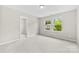 Bright bedroom featuring carpet flooring, fresh paint and a large window at 614 Oldham Ln, Rock Hill, SC 29732