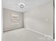 Bright bedroom with plush carpet, neutral paint, and a window at 614 Oldham Ln, Rock Hill, SC 29732