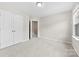 Comfortable bedroom with plush carpet, closet with doors, and neutral paint at 614 Oldham Ln, Rock Hill, SC 29732