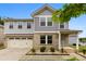 Charming two-story home featuring a brick facade, attached garage, and well-manicured landscaping at 614 Oldham Ln, Rock Hill, SC 29732