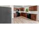 Cozy kitchen featuring wooden cabinets, modern appliances, and a tile backsplash at 614 Oldham Ln, Rock Hill, SC 29732