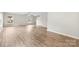 Spacious living room with light wood floors, neutral walls, and a staircase leading to the second floor at 614 Oldham Ln, Rock Hill, SC 29732