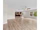 Open living space featuring wood floors, a ceiling fan, large windows, and easy access to kitchen at 614 Oldham Ln, Rock Hill, SC 29732