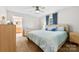 Bright bedroom featuring a ceiling fan, neutral walls, and ensuite bathroom at 619 Archibald Rd, Concord, NC 28025