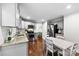 Bright kitchen with granite counters, stainless appliances, and a dining area for Gathering meals at 619 Archibald Rd, Concord, NC 28025