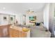 Open living area featuring a sectional sofa, hardwood floors, and a smooth transition to the outdoors at 619 Archibald Rd, Concord, NC 28025
