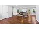 Comfortable living space featuring hardwood floors, a stylish sectional sofa, and a mounted TV at 619 Archibald Rd, Concord, NC 28025