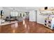 Open-concept living room with hardwood floors and neutral décor seamlessly connects to the kitchen at 619 Archibald Rd, Concord, NC 28025