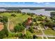 Stunning aerial view of the home nestled amongst trees with lake views at 7923 Mountain Shore Dr, Sherrills Ford, NC 28673