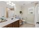 Bright bathroom features a white sink vanity and shower with neutral color scheme at 7923 Mountain Shore Dr, Sherrills Ford, NC 28673