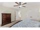 Bedroom featuring neutral walls, carpet, and a wooden dresser with an open doorway at 7923 Mountain Shore Dr, Sherrills Ford, NC 28673