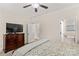 Comfortable bedroom with a dresser, TV, and entry into the bathroom at 7923 Mountain Shore Dr, Sherrills Ford, NC 28673