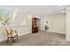 Carpeted bonus room with a display cabinet, natural light and a bathroom at 7923 Mountain Shore Dr, Sherrills Ford, NC 28673