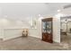 Carpeted bonus room with a decorative display cabinet and natural light at 7923 Mountain Shore Dr, Sherrills Ford, NC 28673