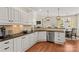 Bright kitchen featuring white cabinets, granite countertops, and stainless steel appliances at 7923 Mountain Shore Dr, Sherrills Ford, NC 28673