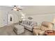 Spacious carpeted living space with ceiling fan and comfortable seating arrangements at 7923 Mountain Shore Dr, Sherrills Ford, NC 28673