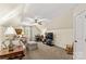 Attic living space with carpeting, ceiling fan, sitting area, desk, and TV at 7923 Mountain Shore Dr, Sherrills Ford, NC 28673