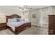 Main bedroom with hardwood bed frame, ceiling fan, and lots of natural light at 7923 Mountain Shore Dr, Sherrills Ford, NC 28673