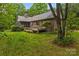 This home features a screened porch, wooden deck, and private backyard at 8368 Fairfield Forest Rd, Denver, NC 28037