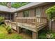 Wooden deck, brick supports, with lush greenery, perfect for outdoor relaxation at 8368 Fairfield Forest Rd, Denver, NC 28037