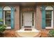 Charming brick home featuring a welcoming front door with sidelights and teal shutters at 8368 Fairfield Forest Rd, Denver, NC 28037