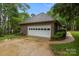 Brick home with a two car garage, driveway and landscaping at 8368 Fairfield Forest Rd, Denver, NC 28037