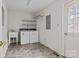 Practical laundry room with white walls, sink, washer, dryer, and access to the exterior at 8368 Fairfield Forest Rd, Denver, NC 28037
