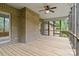 Screened-in back patio features wood decking and brick exterior at 8368 Fairfield Forest Rd, Denver, NC 28037