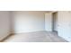 Carpeted bedroom with a closet and white doors provides a comfortable and neutral space at 9612 Pointer Rd # 59, Huntersville, NC 28078