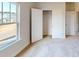 Bedroom with big window, carpet flooring and a closet provides comfort and natural light at 9612 Pointer Rd # 59, Huntersville, NC 28078