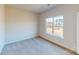 Bedroom with a window, carpet flooring, and white walls at 9612 Pointer Rd # 59, Huntersville, NC 28078