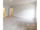 A large bonus room with ensuite bath, and neutral carpet is versatile and inviting at 9612 Pointer Rd # 59, Huntersville, NC 28078
