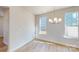 Cozy dining room featuring wood floors, two windows, and an elegant chandelier at 9612 Pointer Rd # 59, Huntersville, NC 28078
