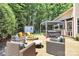 Beautiful backyard featuring a stone patio with outdoor seating, a hot tub, and a fire pit for entertainment at 9930 Karras Commons Way, Matthews, NC 28105