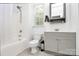 Cozy bathroom featuring a tub/shower combo and a gray vanity at 9930 Karras Commons Way, Matthews, NC 28105