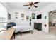 Well-lit bedroom with a ceiling fan, decorative lights, and decor, creating a cozy and personalized space at 9930 Karras Commons Way, Matthews, NC 28105