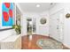 Bright foyer with hardwood floors, a round rug, and an artful decor at 9930 Karras Commons Way, Matthews, NC 28105
