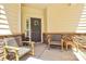 Inviting front porch with seating, a wreath on the door, and stone accents at 9930 Karras Commons Way, Matthews, NC 28105