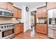 Well-maintained kitchen with stainless steel appliances and wood cabinetry at 9930 Karras Commons Way, Matthews, NC 28105