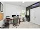 Functional office space with ample natural light, a large desk, and golf equipment for leisure at 9930 Karras Commons Way, Matthews, NC 28105