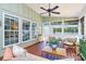 Inviting sunroom with ample seating and natural light, perfect for relaxation and enjoying the scenery at 9930 Karras Commons Way, Matthews, NC 28105