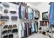 Organized walk-in closet with shelving and hanging space for clothes and shoes at 9930 Karras Commons Way, Matthews, NC 28105