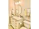 Bathroom with vanity, white cabinets, sink, and decorative mirror at 101 Keswick Ln, Mooresville, NC 28117
