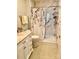 Bathroom with marbled shower, decorative shower curtain, white cabinets and marbled countertop at 101 Keswick Ln, Mooresville, NC 28117
