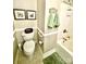Bathroom featuring a toilet and tub with neutral colored walls and matching towels at 101 Keswick Ln, Mooresville, NC 28117
