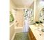 Clean bathroom with a shower, tub, vanity, and fresh green accents at 101 Keswick Ln, Mooresville, NC 28117
