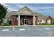Clubhouse exterior featuring a brick facade and a well-maintained parking lot at 101 Keswick Ln, Mooresville, NC 28117